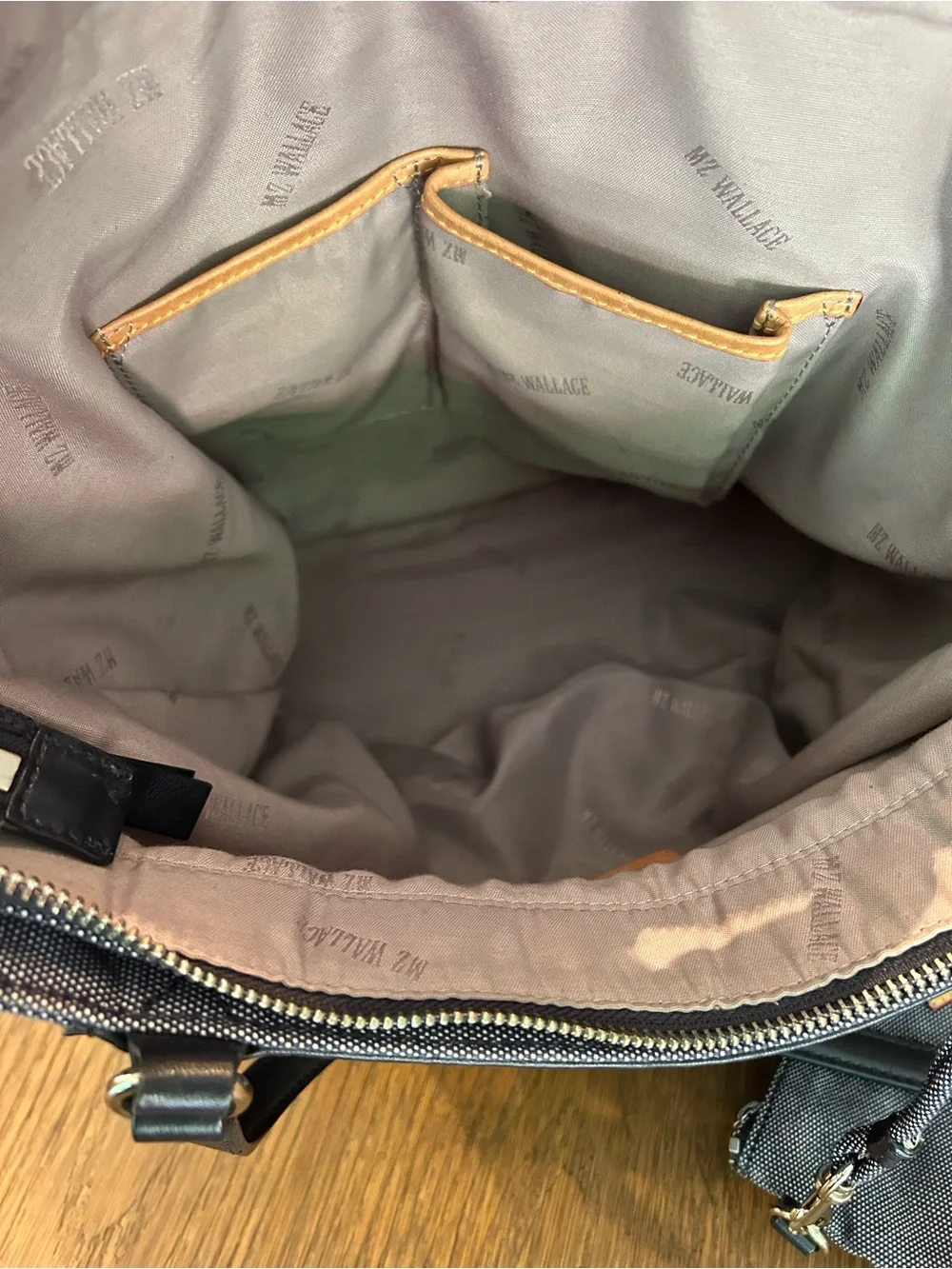 MZ Wallace navy canvas tote with leather pocket and handles